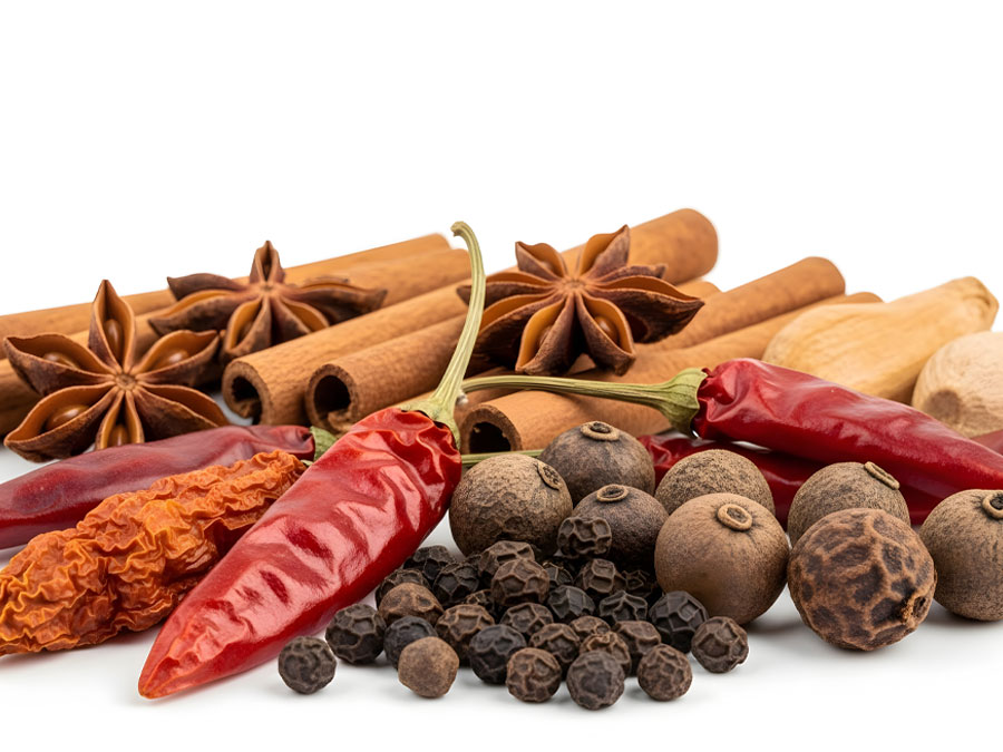 Anise, cinnamon and spices arranged on a dark surface